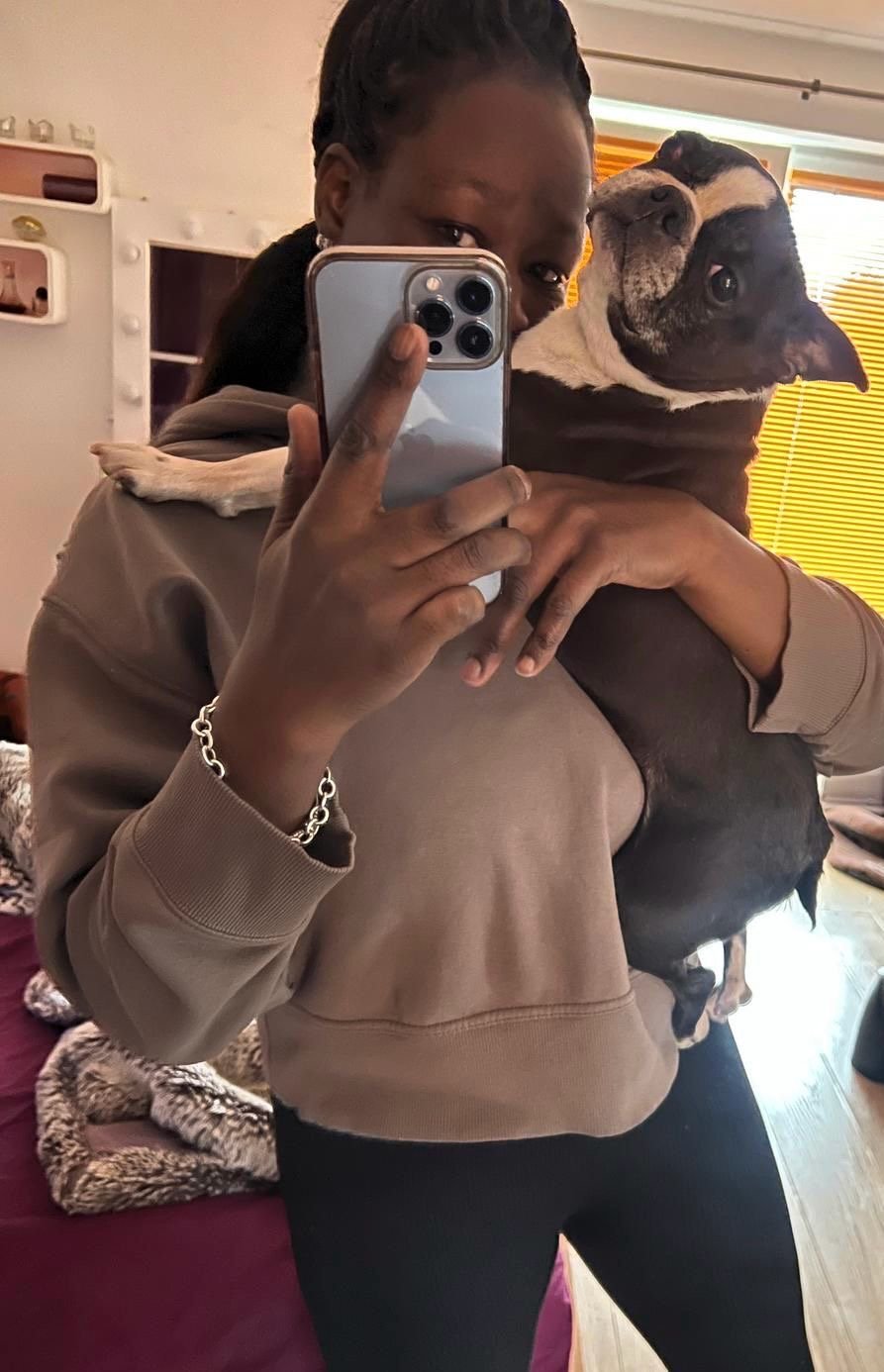 Rere holding Bonnie, her beloved rescue dog, in a moment of affection and love.